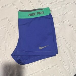 Nike Pro Purple Shorts with Green Waistband